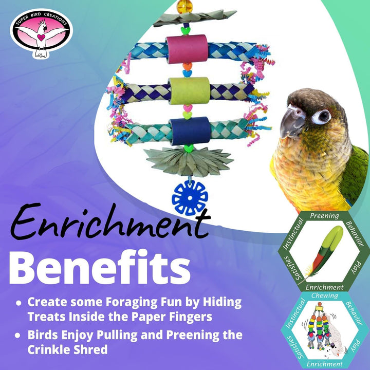 A colorful bird enrichment toy set displayed on a white oval background with a small parrot shown on the right. The product includes braided rope, paper fingers, crinkle shred, and hanging toys in pink, blue, green, yellow, and purple.
