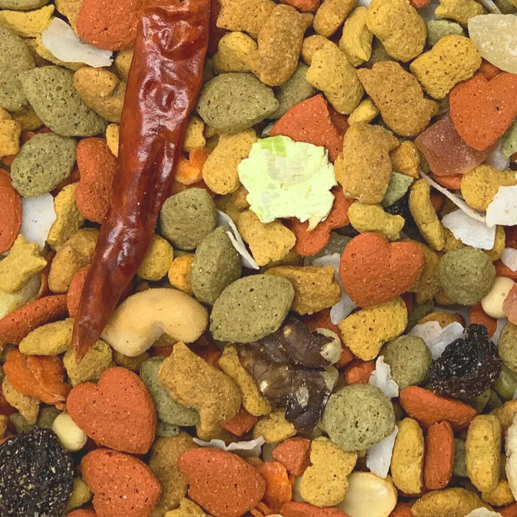 Assorted colorful pet food with a red pepper and leaf among them.