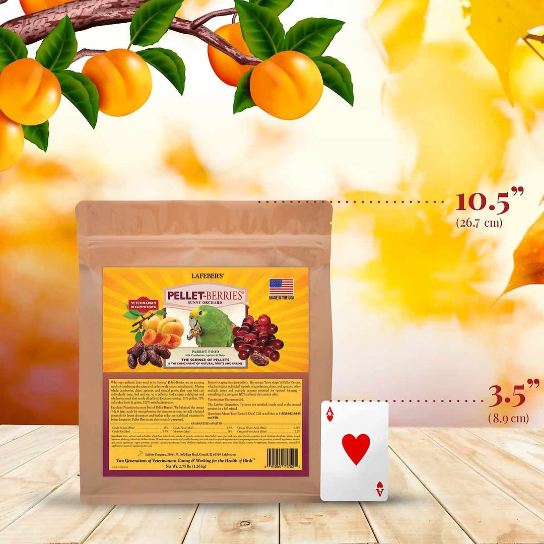Laferr's Pellet Berries packaging with a playing card for scale on a wooden surface with peach branches.