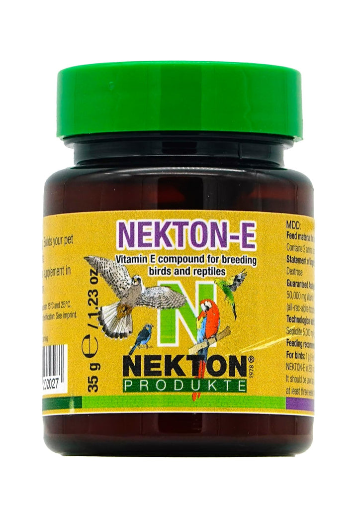 A bottle of Nekt-on-E Vitamin E compound for breeding birds and reptiles by Nekt-on Produkte, featuring a bright green cap, a yellow label with colorful bird illustrations, and a dark brown container.