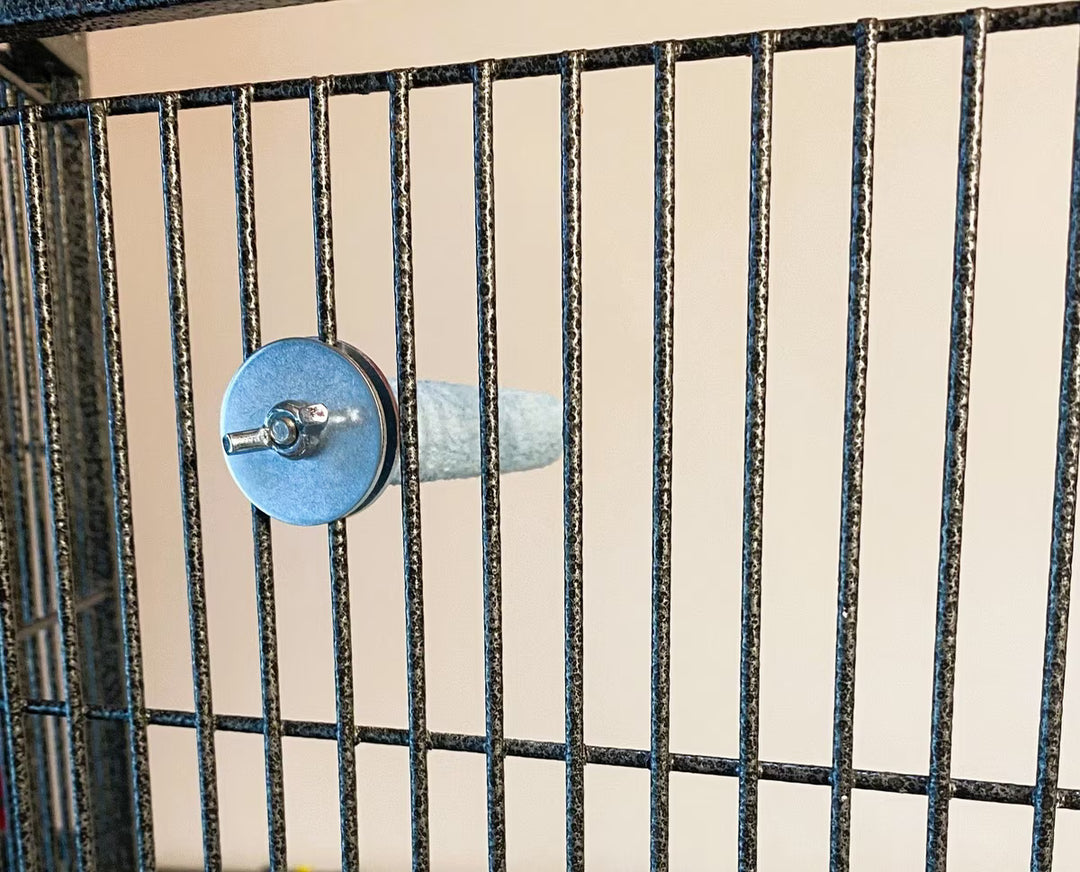 Metallic object with blue and silver components on a grid background