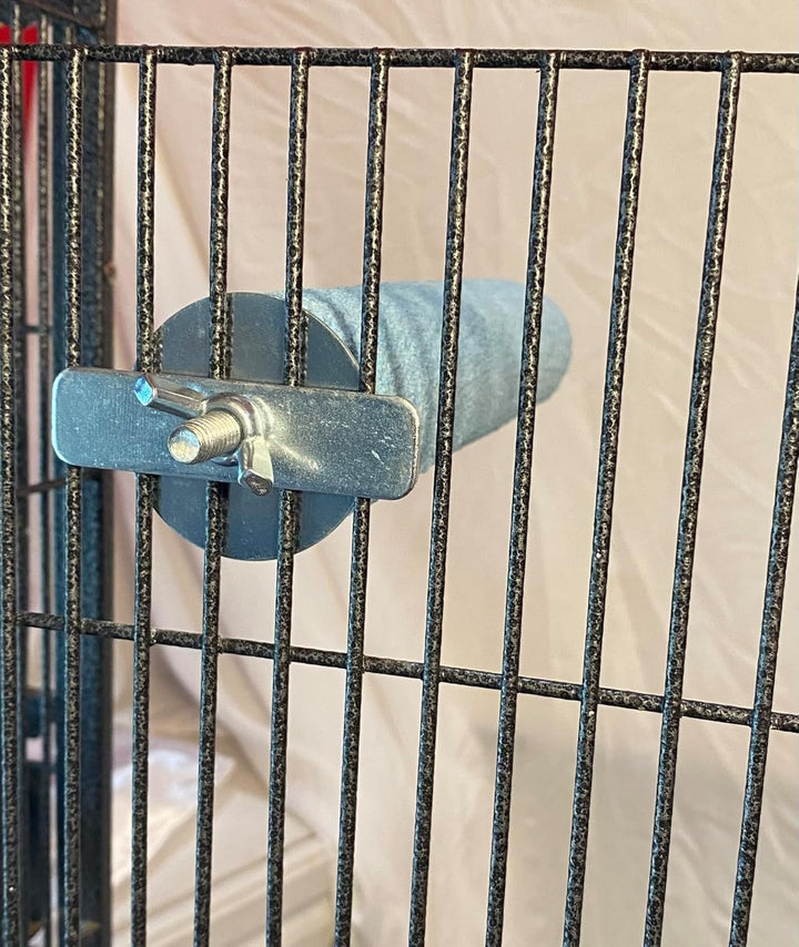 Metal gate latch on a metal fence with a blurred background