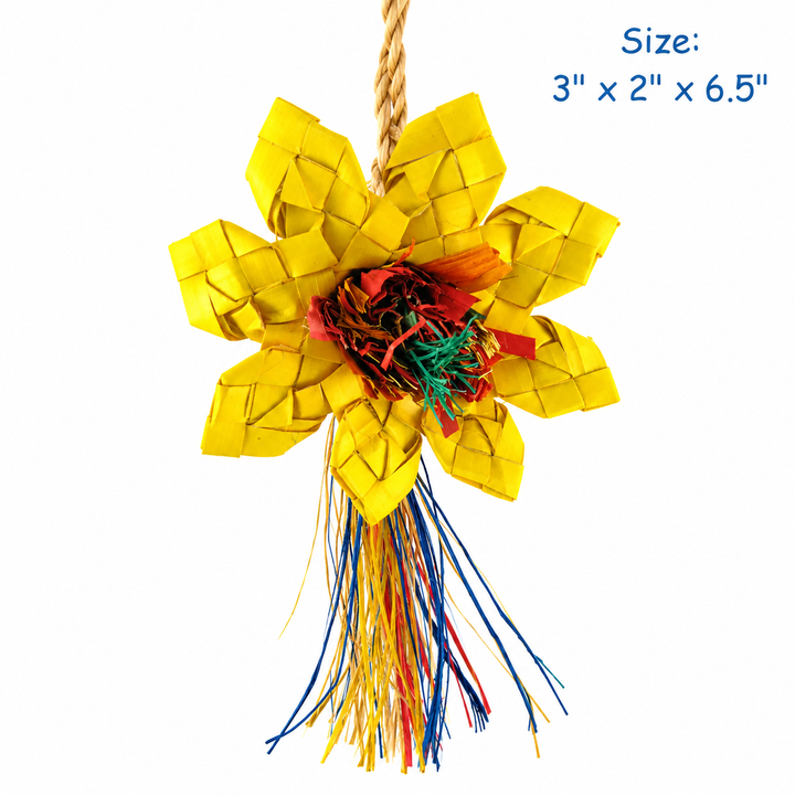A handmade woven flower-shaped hanging ornament made from yellow paper petals with a multicolored fringed center and hanging cords, shown on a white background with blue size text in the top right - Planet Pleasures Sunflower Bird Toy – Small