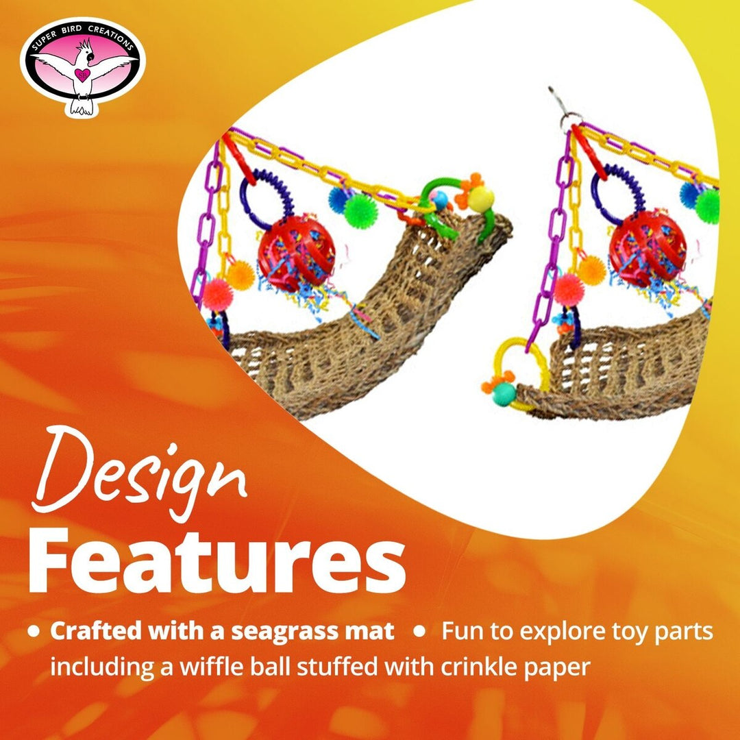 Colorful Super Bird Creations Flying Trapeze toy with seagrass mat and wiffle ball on an orange background