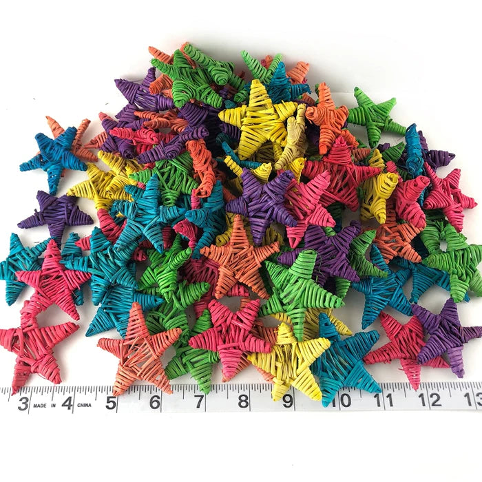 Super Bird Creations Vine Stars Small - Dyed (100): Colorful star-shaped objects with a ruler for scale on a white background