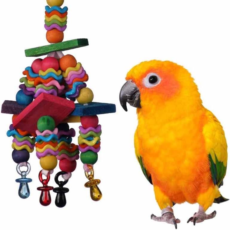 Super Bird Creations Wiggles & Wafers bird toy next to a parrot on a white background