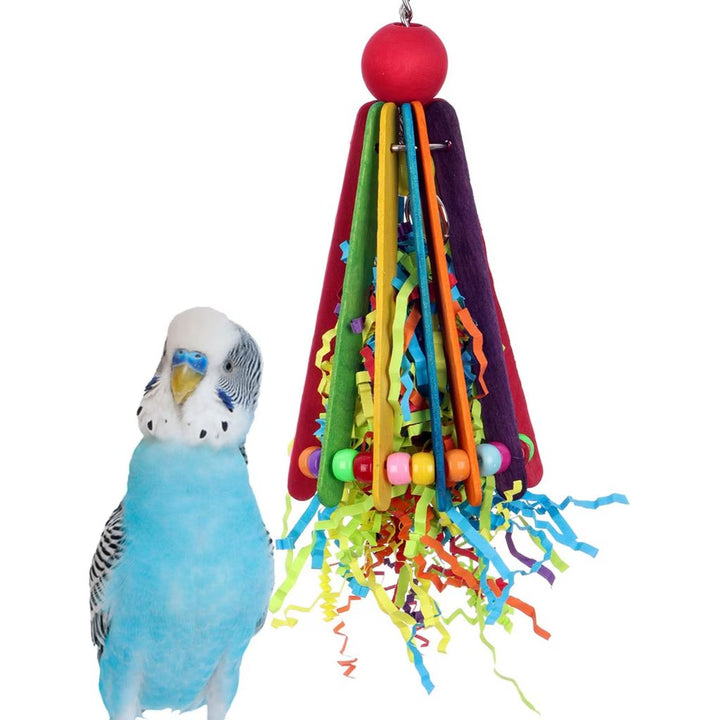 Colorful bird toy (Super Bird Creations Clownin' Around) with ribbons and beads next to a parakeet on a white background
