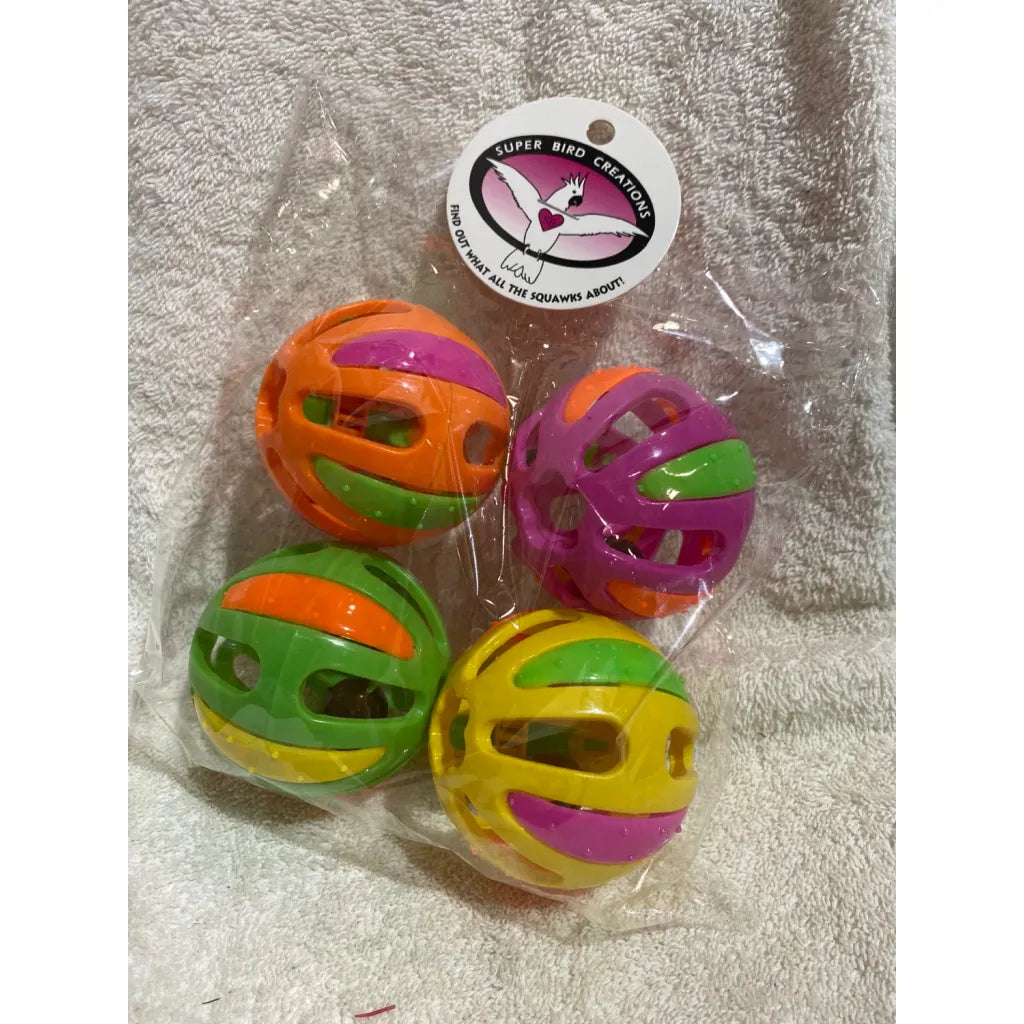 Colorful Super Bird Kaleidoballs in packaging with a brand label on a towel background