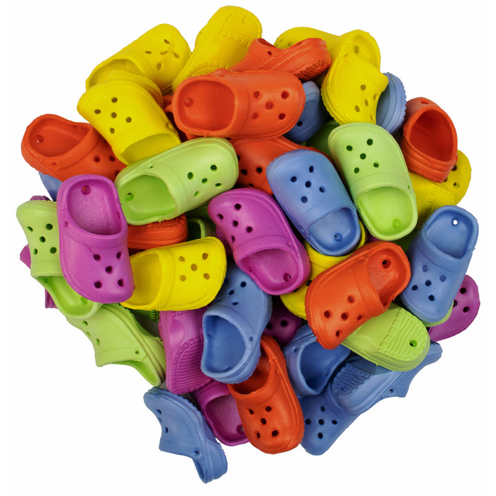 Colorful pile of Super Bird Creations Crocs (50) on a white background