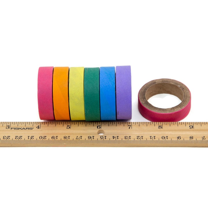 Set of colorful Super Bird Creations Fatty Bagels with a ruler for scale on a white background