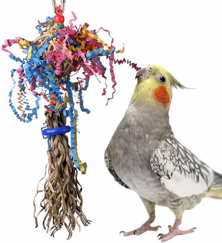 Colorful bird toy with a parrot perched on it against a white background