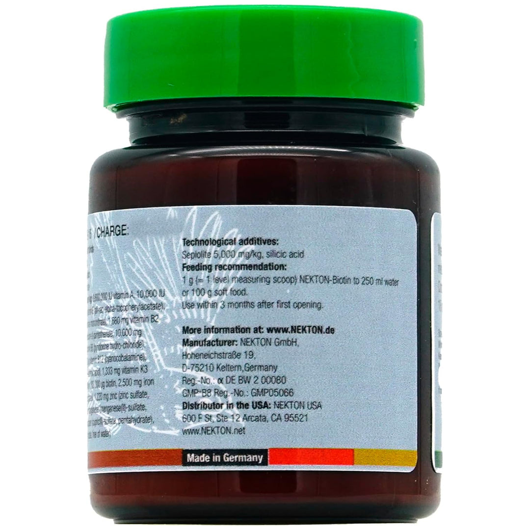 A close-up of the back of a dark brown plastic bottle with a bright green cap and a white label, showing printed text and a 'Made in Germany' banner.